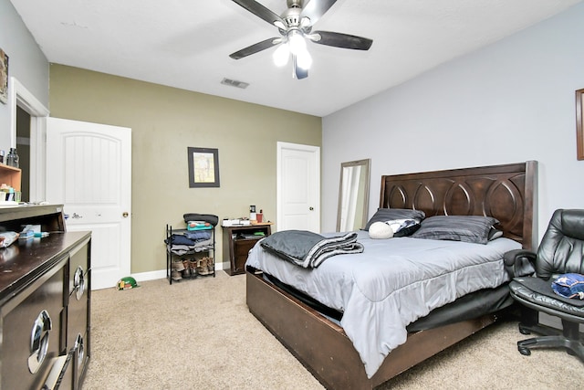 bedroom with light colored carpet and ceiling fan