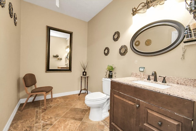 10510 Crosby Lynchburg Rd, Crosby, TX 77532 - half bathroom with toilet, vanity, baseboards, and stone finish flooring