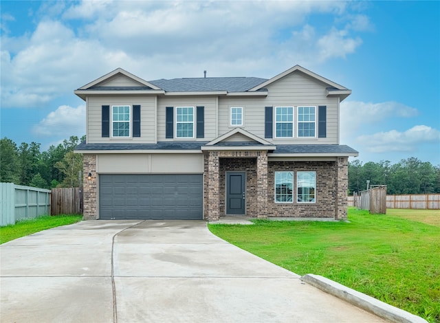 view of front of house featuring a front lawn and a garage