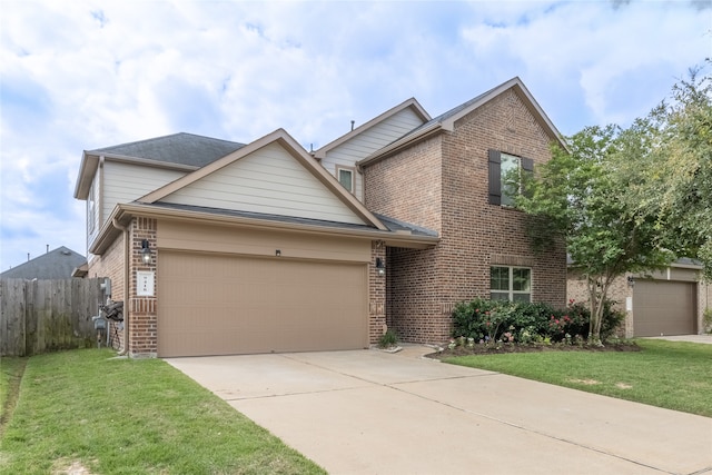 view of front of house with a garage and a front lawn