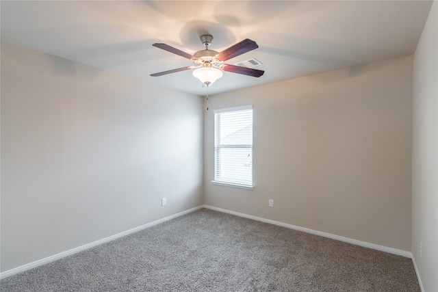 spare room with carpet flooring and ceiling fan