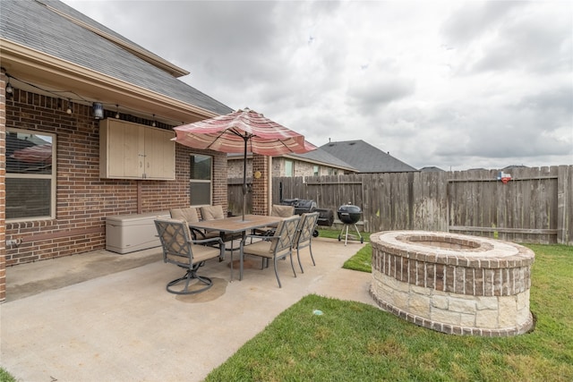 view of patio / terrace featuring a fire pit