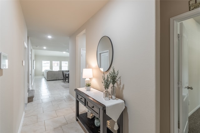 hallway featuring light tile patterned floors