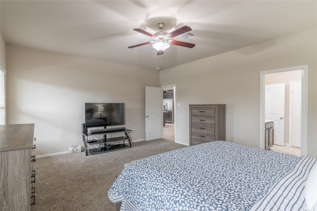 carpeted bedroom with ceiling fan and ensuite bathroom