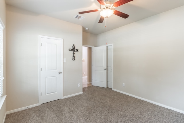 unfurnished bedroom with carpet flooring and ceiling fan