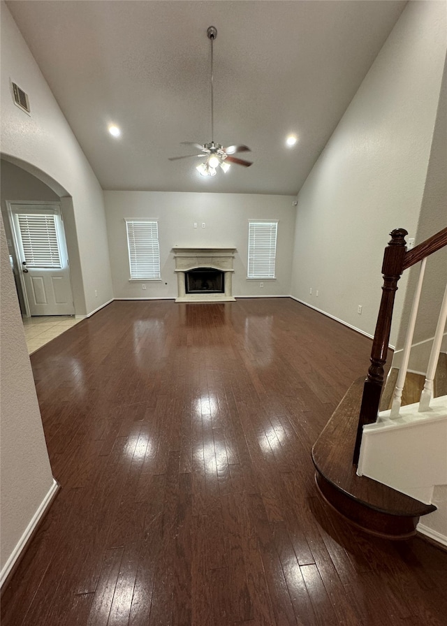 unfurnished living room with hardwood / wood-style floors and ceiling fan