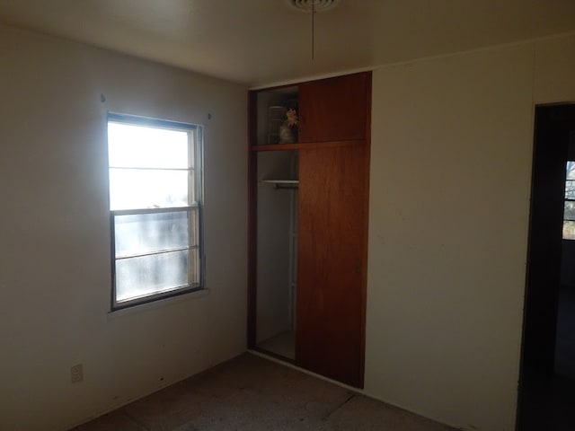 unfurnished bedroom with a closet