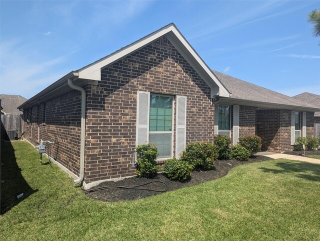 view of property exterior with a yard