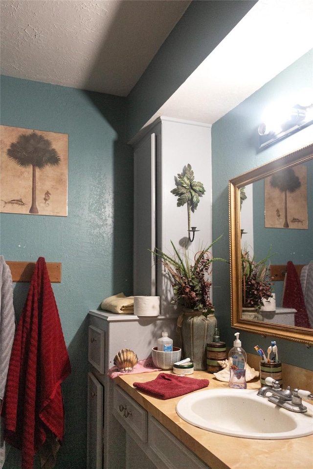 bathroom featuring vanity and a textured ceiling