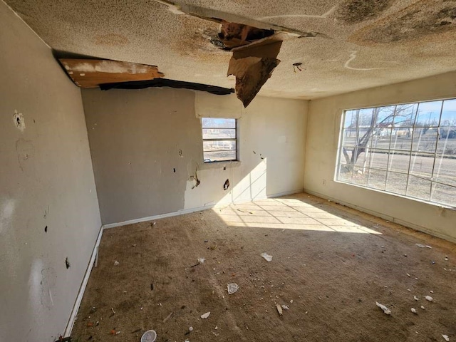 spare room featuring a textured ceiling