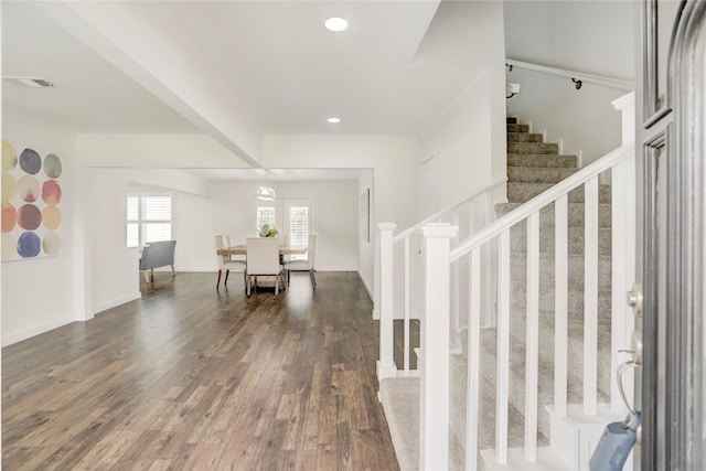 entryway with dark hardwood / wood-style flooring