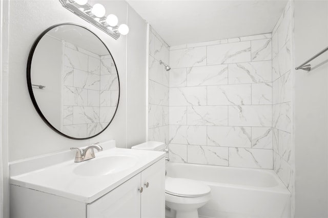 full bathroom featuring toilet, tiled shower / bath combo, and vanity