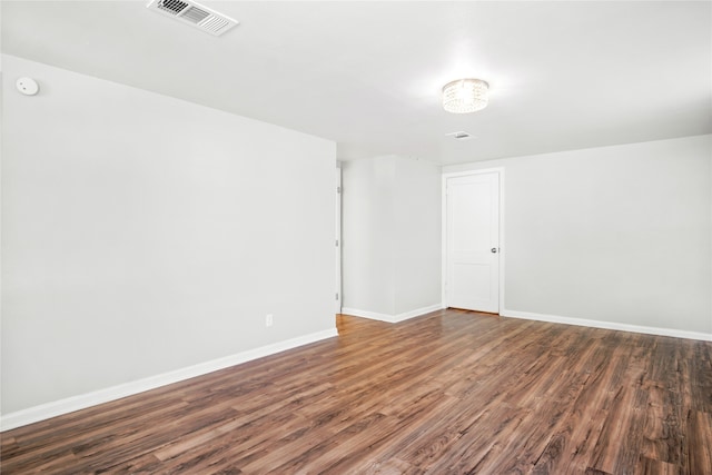 unfurnished room with hardwood / wood-style flooring