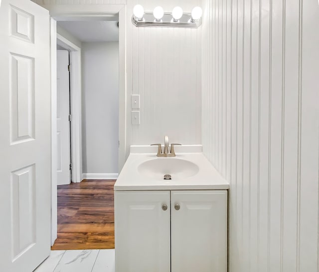 bathroom featuring vanity and hardwood / wood-style floors