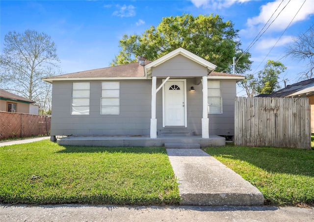 bungalow with a front yard