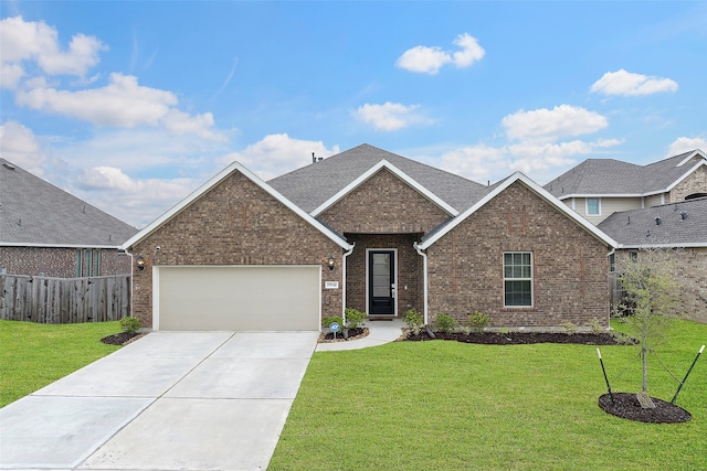 view of front facade with a front yard and a garage