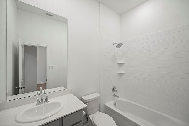 full bathroom with vanity, toilet, and tiled shower / bath combo