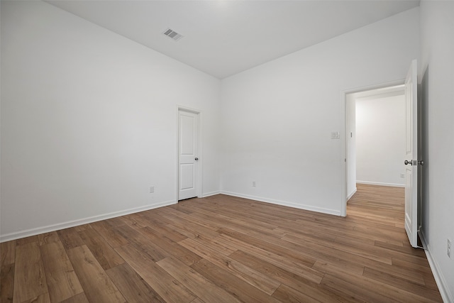 spare room featuring hardwood / wood-style flooring