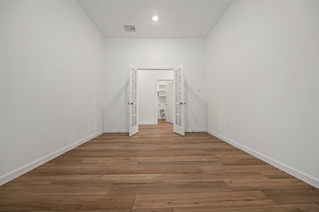 spare room with wood-type flooring