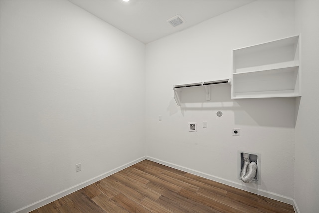 washroom featuring washer hookup, hookup for a gas dryer, hookup for an electric dryer, and dark hardwood / wood-style flooring