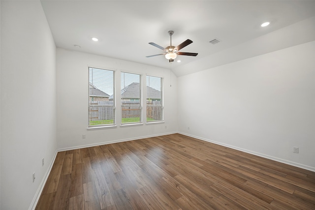 empty room featuring ceiling fan and dark hardwood / wood-style flooring