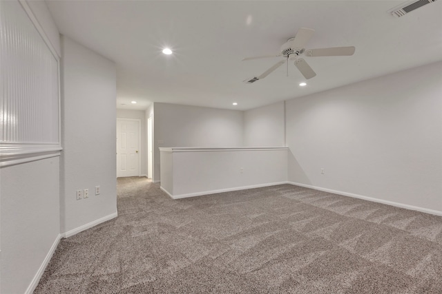 carpeted empty room with ceiling fan