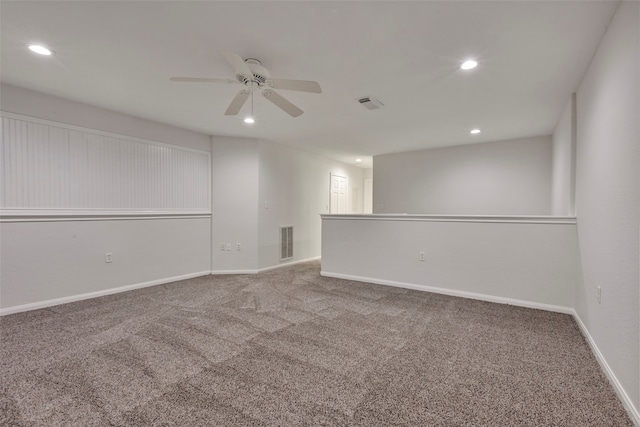 spare room with ceiling fan and carpet floors