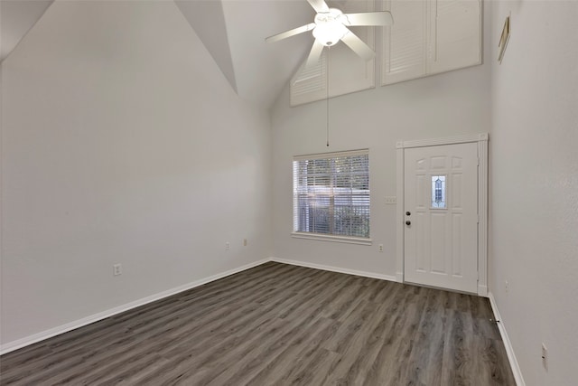 foyer with ceiling fan, high vaulted ceiling, and dark hardwood / wood-style flooring