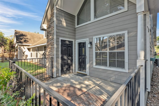 wooden terrace featuring a yard