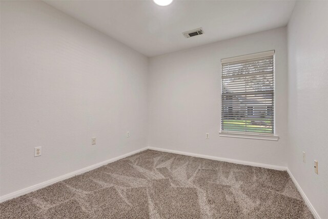 770 Hunt Rd Unit 212, Baytown, TX 77521 - carpeted empty room with visible vents and baseboards