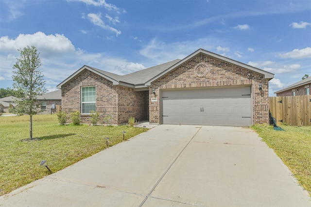 single story home featuring a garage and a front yard