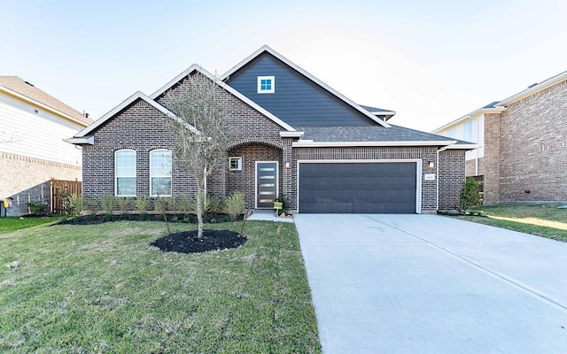 view of front of house with a garage and a front yard