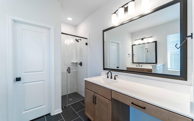 bathroom featuring walk in shower, vanity, and tile patterned flooring