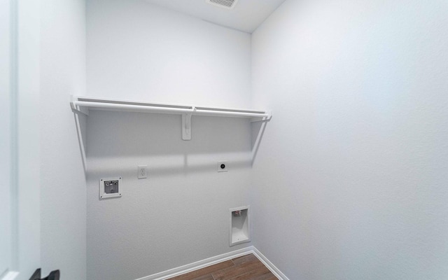 washroom featuring hardwood / wood-style floors, washer hookup, and hookup for an electric dryer