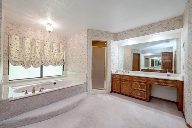 bathroom featuring vanity, a textured ceiling, and plus walk in shower