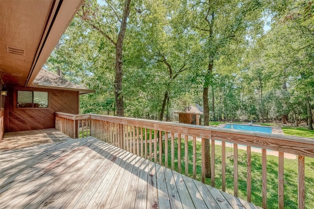 deck featuring an outdoor pool