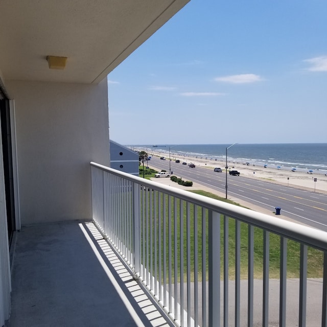 balcony with a view of the beach and a water view