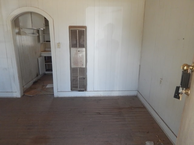 unfurnished room featuring dark hardwood / wood-style flooring