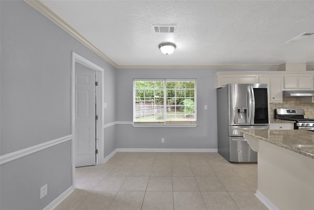 kitchen featuring light stone counters, stainless steel appliances, white cabinetry, tasteful backsplash, and ornamental molding