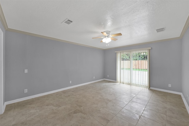 spare room with ceiling fan, crown molding, and a textured ceiling