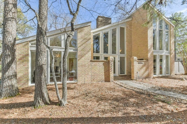 view of front of property featuring a sunroom