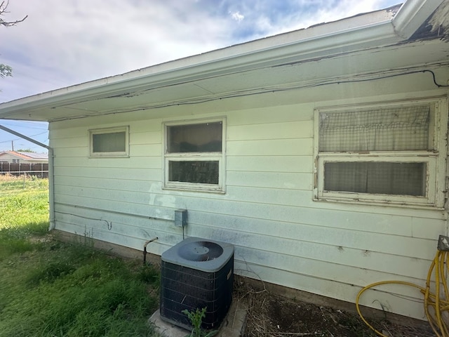 view of side of property featuring central AC unit