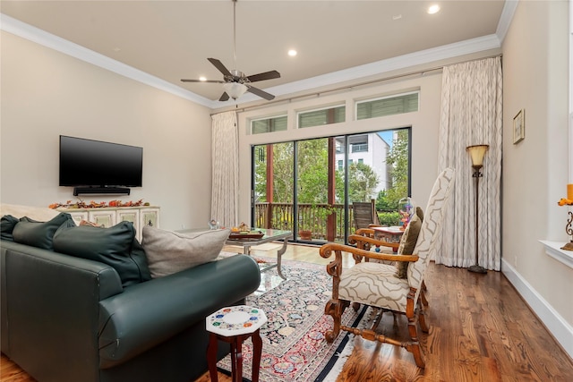 living room featuring baseboards, ceiling fan, crown molding, recessed lighting, and wood finished floors