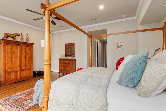 bedroom featuring crown molding, ceiling fan, visible vents, recessed lighting, and wood finished floors