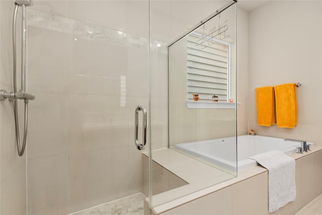 full bath with a bath and a stall shower