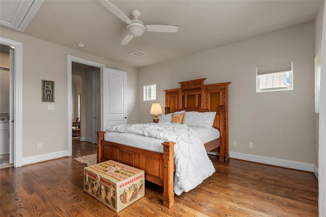 bedroom with ceiling fan, visible vents, baseboards, and wood finished floors