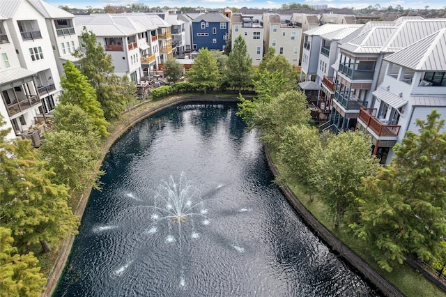 birds eye view of property with a water view and a residential view