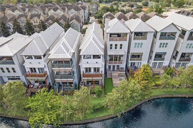 bird's eye view with a water view and a residential view