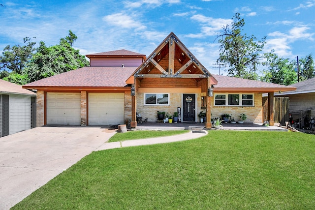 view of front of property with a garage and a front yard