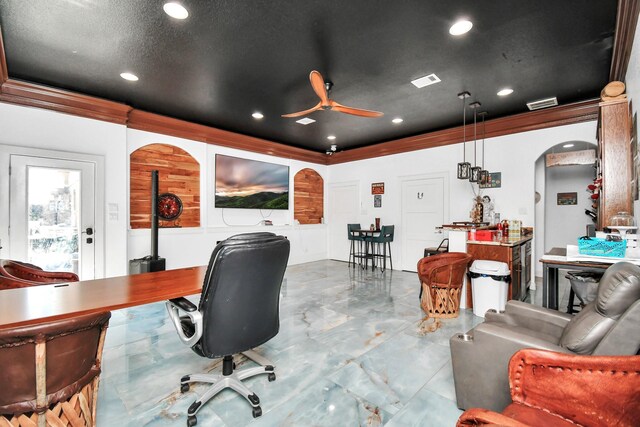 office area with crown molding, a textured ceiling, and ceiling fan